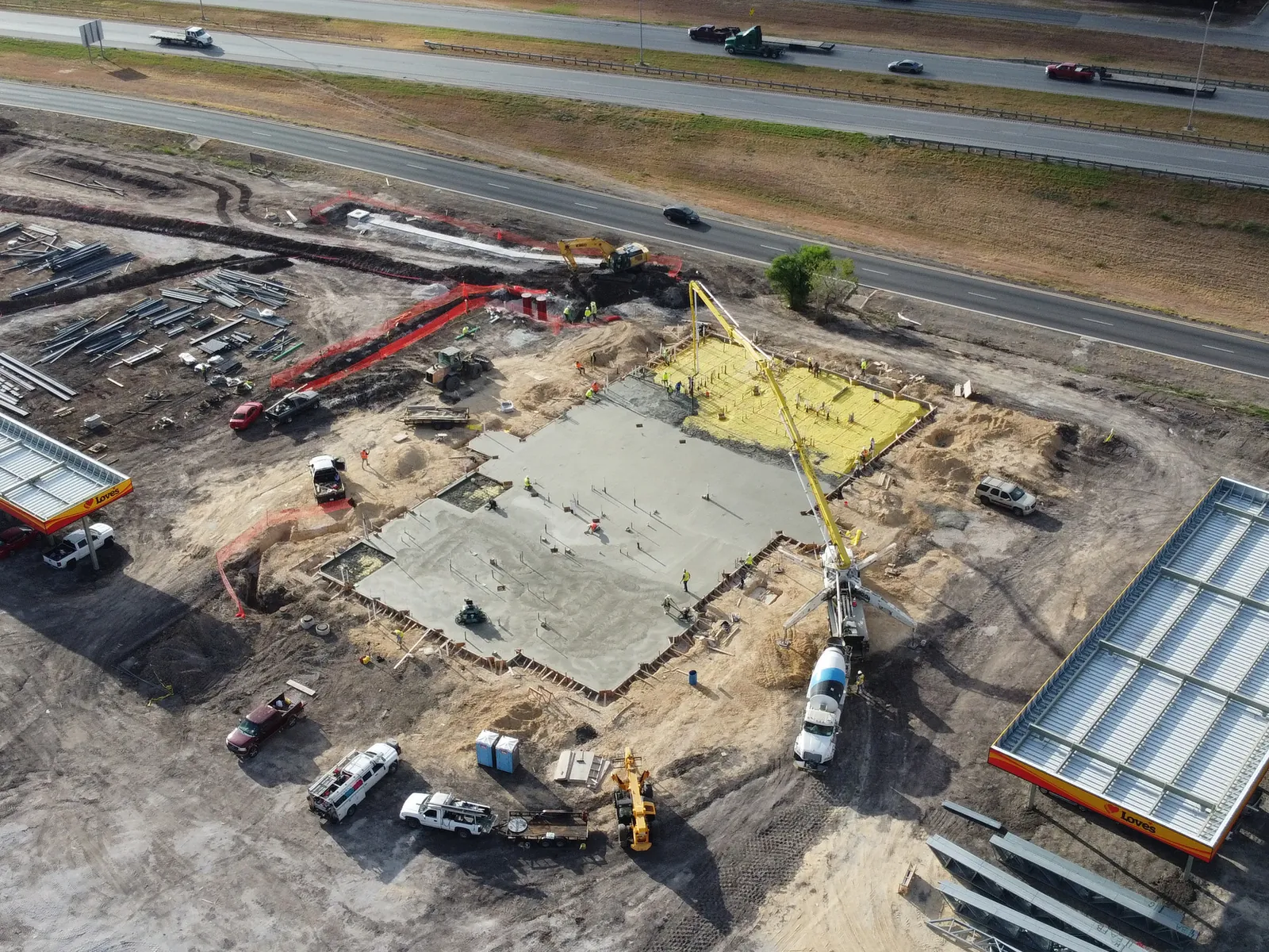 Aerial view of a commercial pad pour with a boom pump
