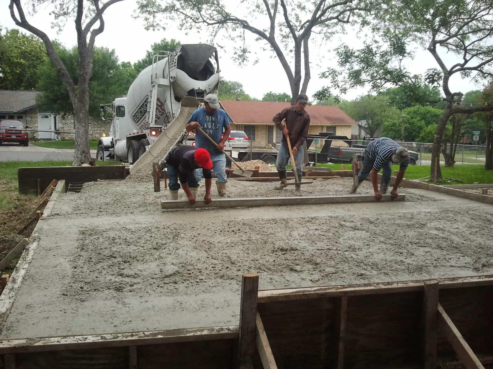 Crew pouring a residential concrete driveway in San Antonio