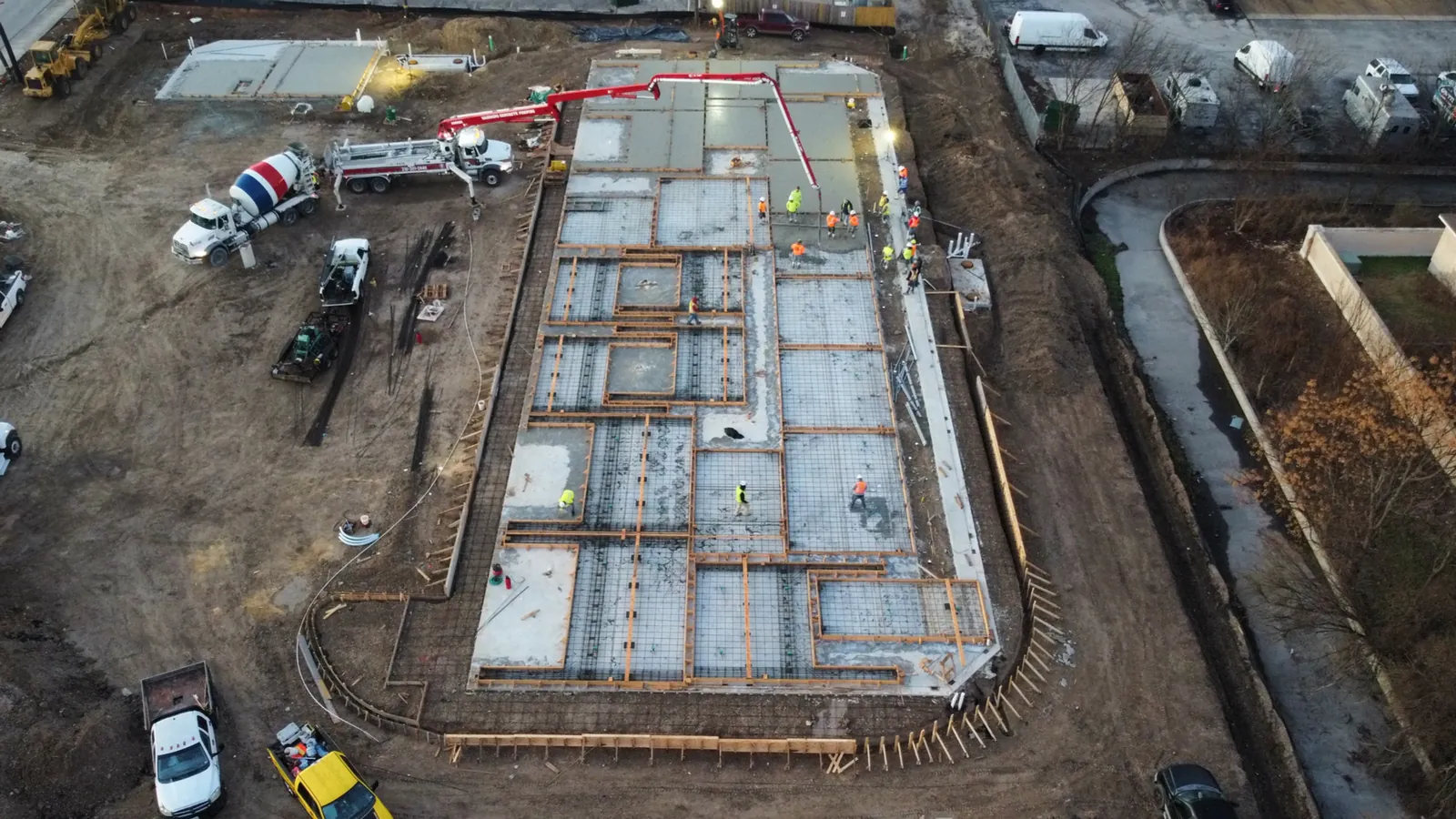 Aerial view of a commercial foundation pour beside the highway