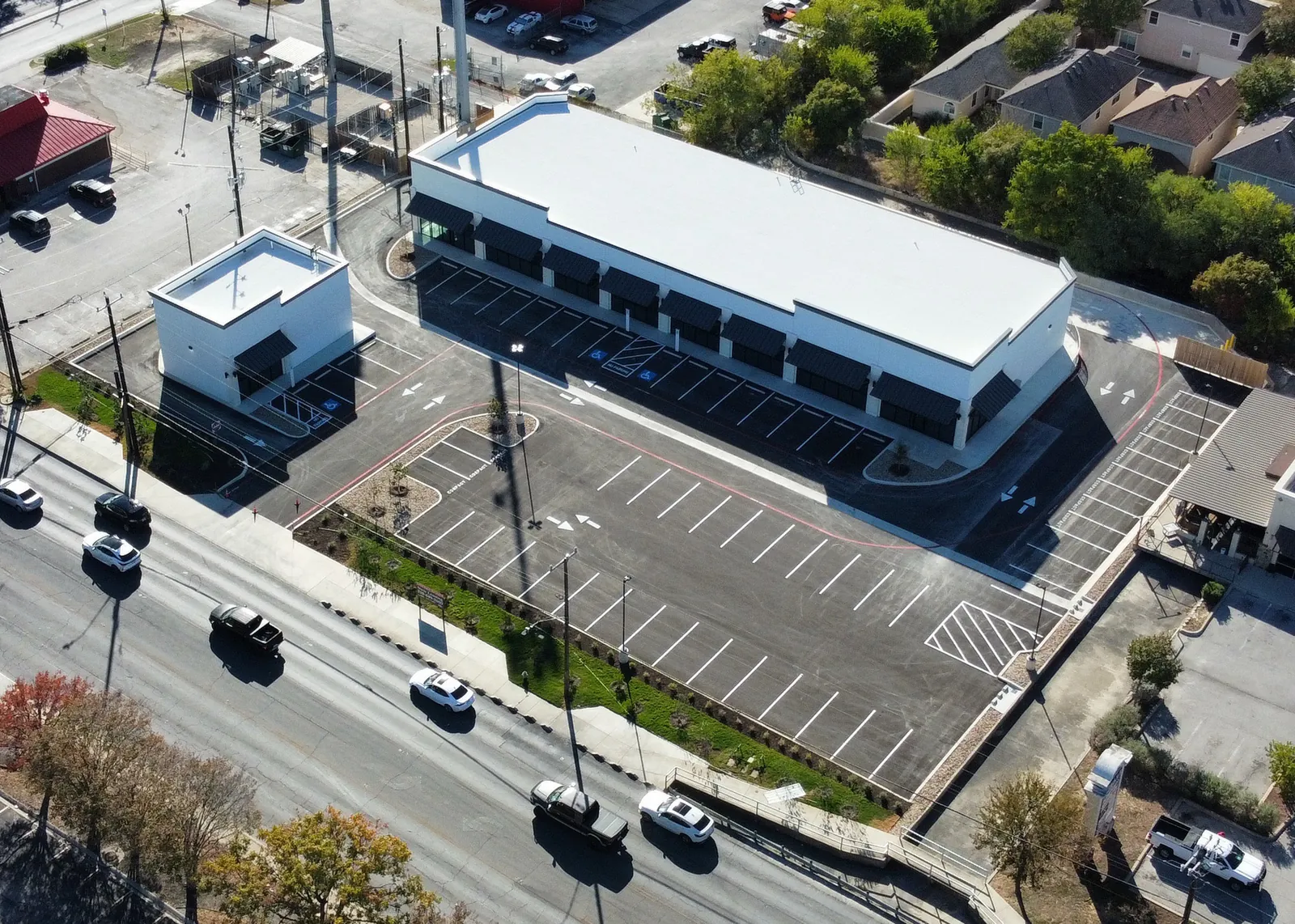Aerial view of a retail center parking lot and sitework